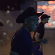 Steven Henderson dancing at the Cowboy Bar in Desert Migration. Photo Credit: 13th Gen Inc.