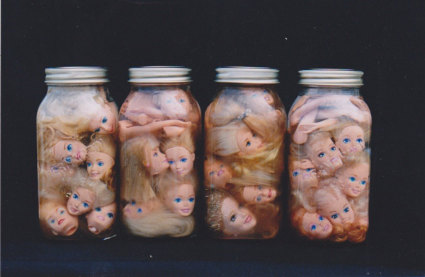 Figure 3. Gabriel Lalonde, Les Barbies dans le vinaigre, 1995-2004, Barbies, mason jars, oil, 18 x 8.75 x 8.75 cm. Collection of the artist.