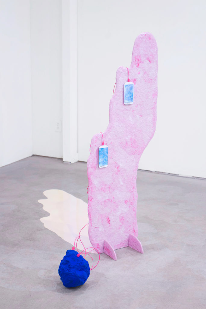 Hannah Newman, Lumps That Leak / Soft Bodies, 2021, epoxy clay, flocking, smartphones, charging cables, single-channel videos, vinyl, and paint. Image courtesy Mario Gallucci.